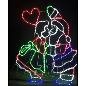 Mrs Clause Kissing Santa